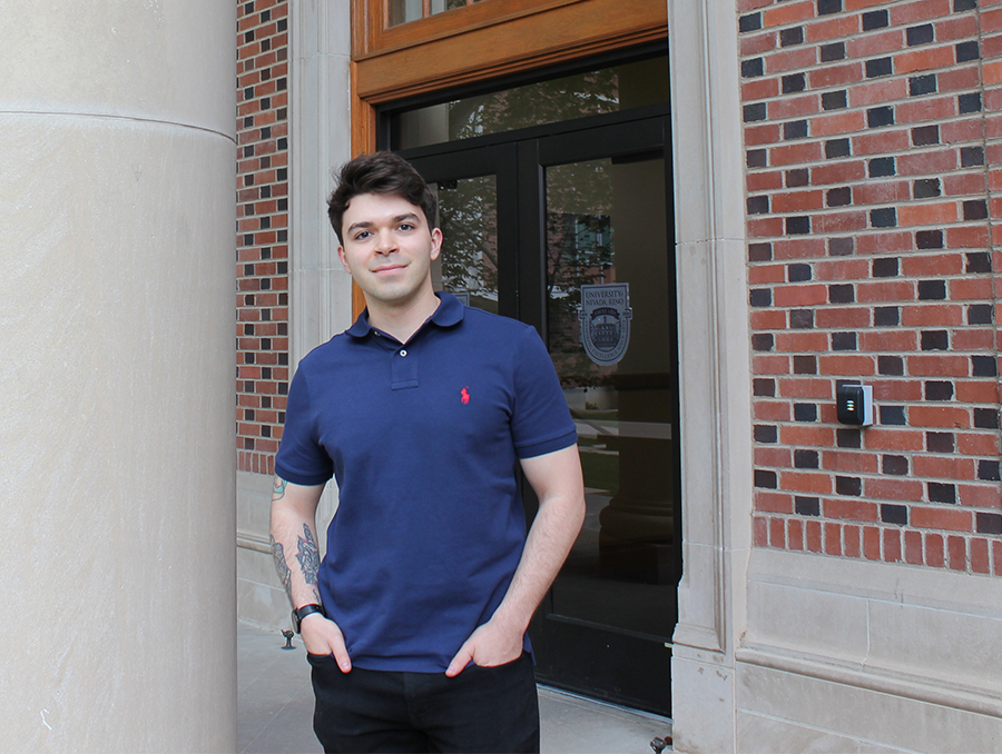 Alessandro Ralls stands in front of the Palmer Engineering building.