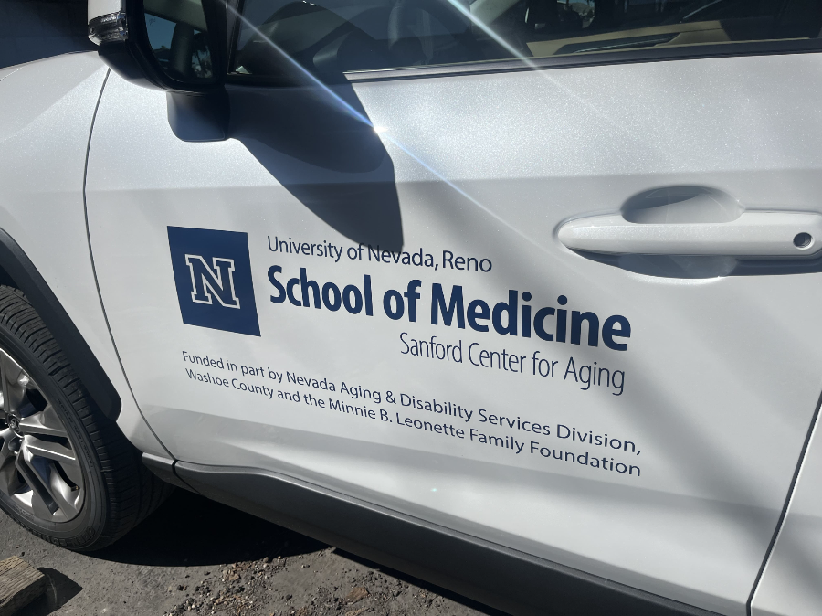 Side of the Sanford vehicle that has the UNR Med logo on it and the words: "Funded in part by Nevada Aging & Disability Services Division,  Washoe County and the Minnie B Leonette Family Foundation.
