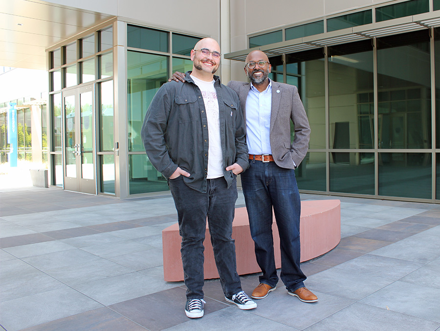 Thomas Selmi and Dev Chidambaram standing outside of the William Pennington Engineering Building,