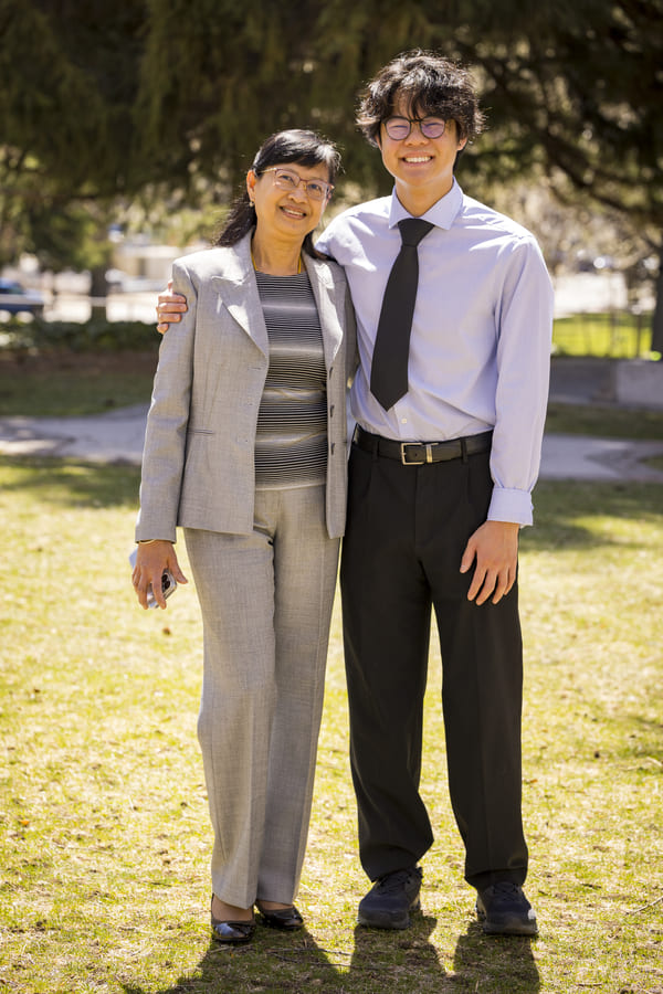 Suchawadee stands next to Jaden outside on the quad.