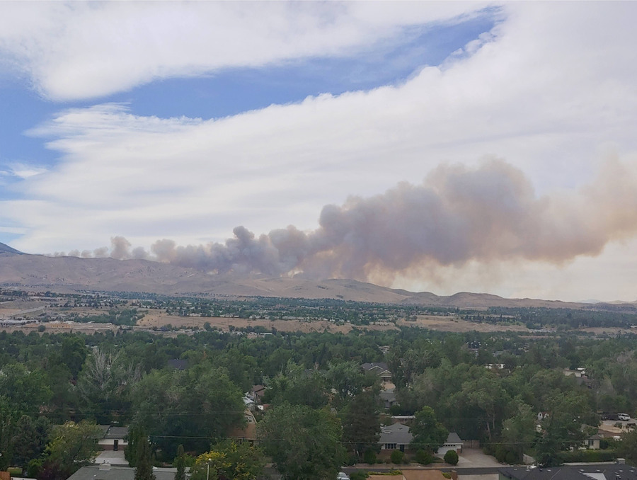 Smoke is seen coming out from the top of Peavine mountain near Reno, Nevada