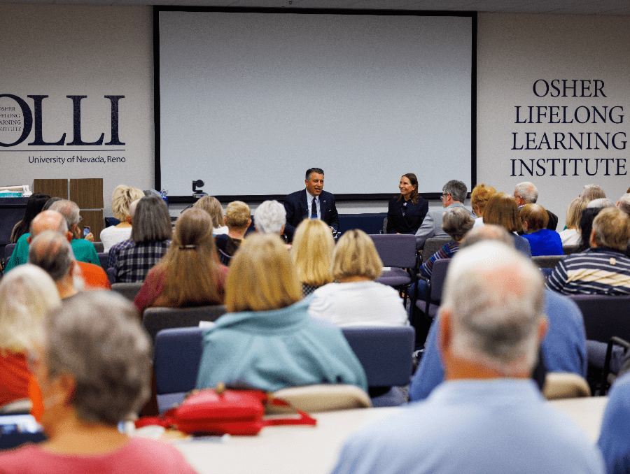 An audience at OLLI listening to President Sandoval and Lauralyn McCarthy