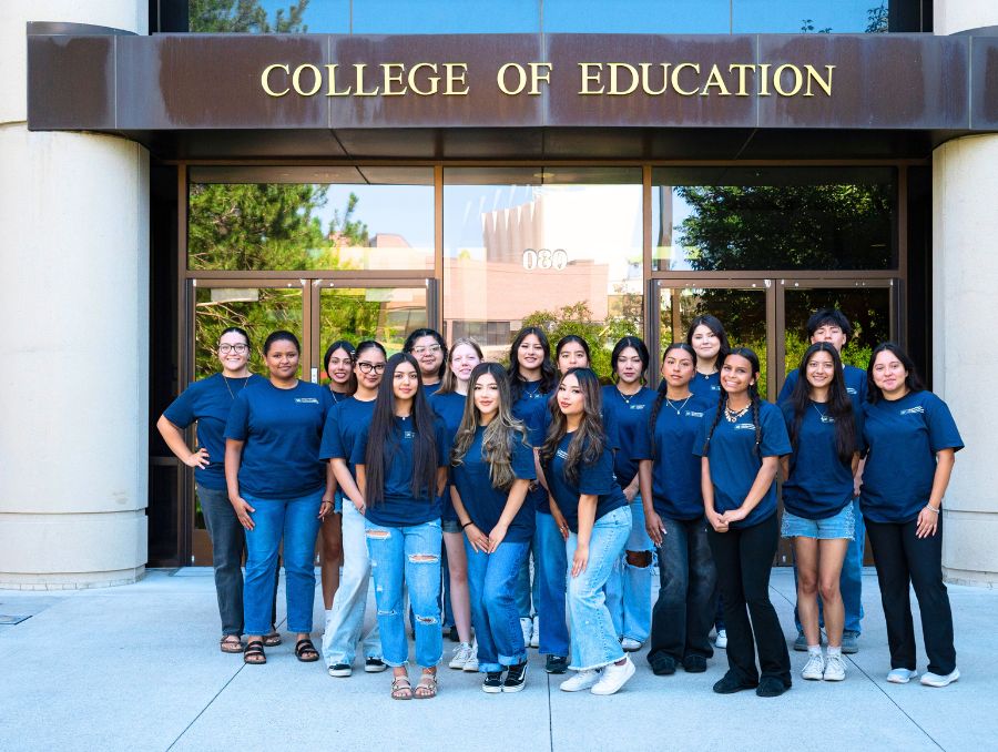 A group of high school participants in front of the William J. Raggio Building.