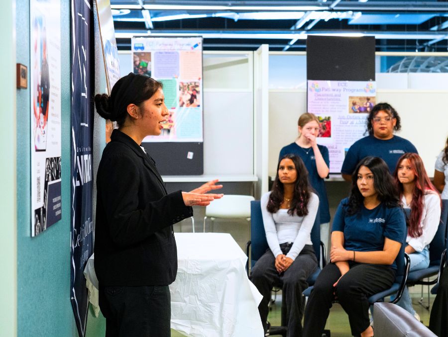 Student presenting in front of the class.