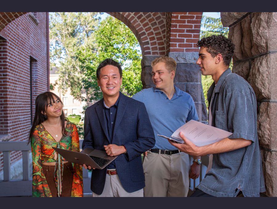 Students standing next to Honors College Dean Matt Means.
