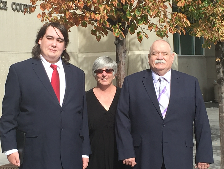 Adam Robert Steele with his parents.