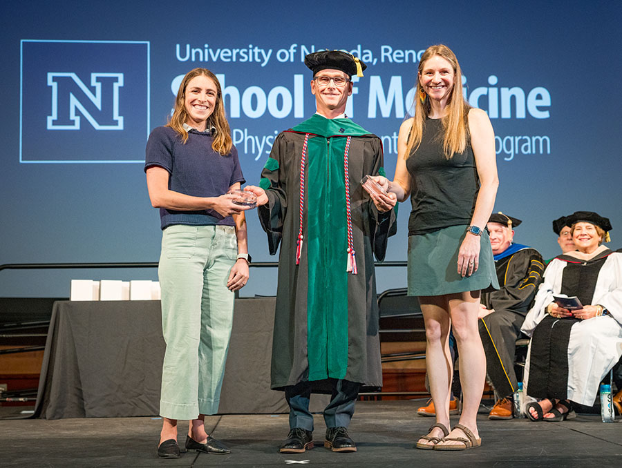 The Class of 2025 selected co-preceptors of the year accepting their award on stage.