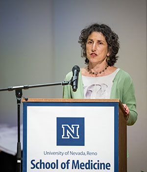 Rita Redberg, M.D., speaking at a podium.