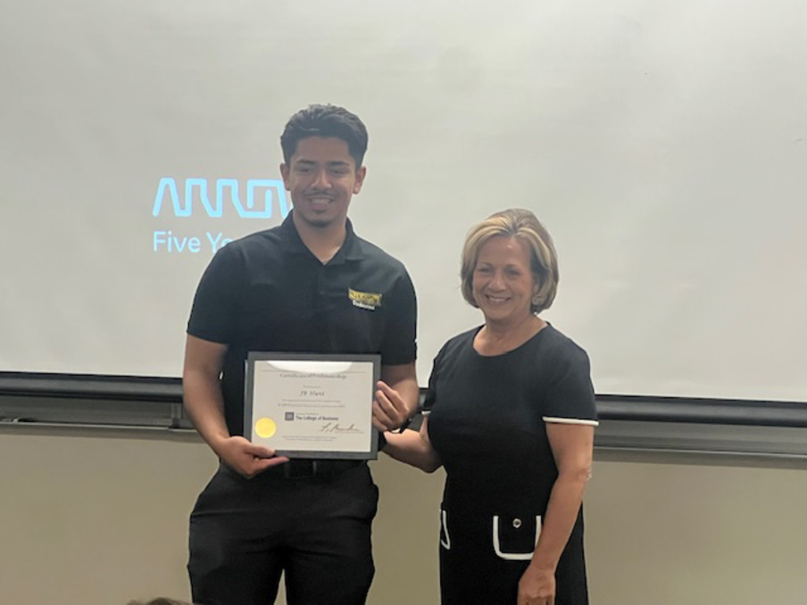 Fernando Lobatos Vidales posing with program director Robyn Brunscher.