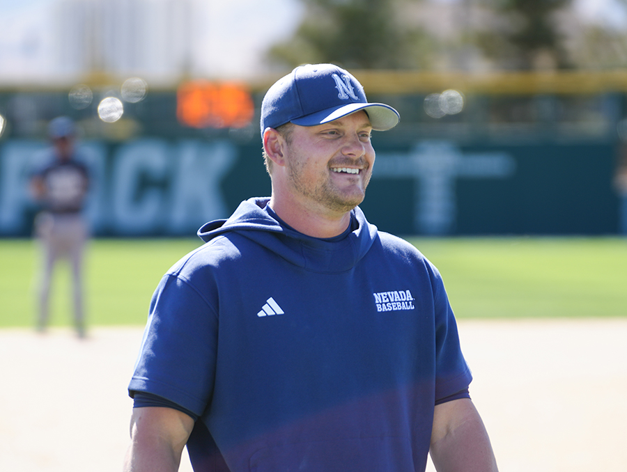 New Nevada Baseball head coach smiling at practice.