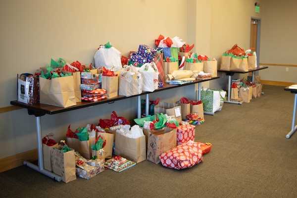 Wrapped presents on a desk after being prepared by faculty.