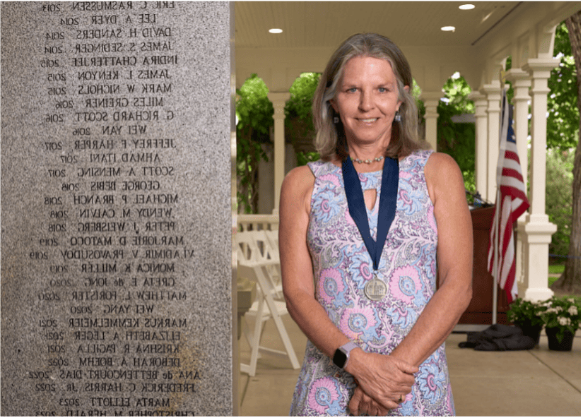 Marta Elliot standing and smiling for a picture.