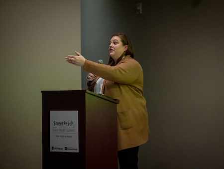 StreetReach presenter Corinne Feldman addresses the audience.
