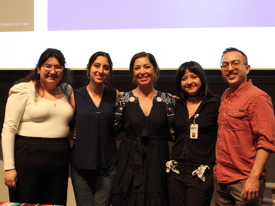 A group of individuals pose together at the event.