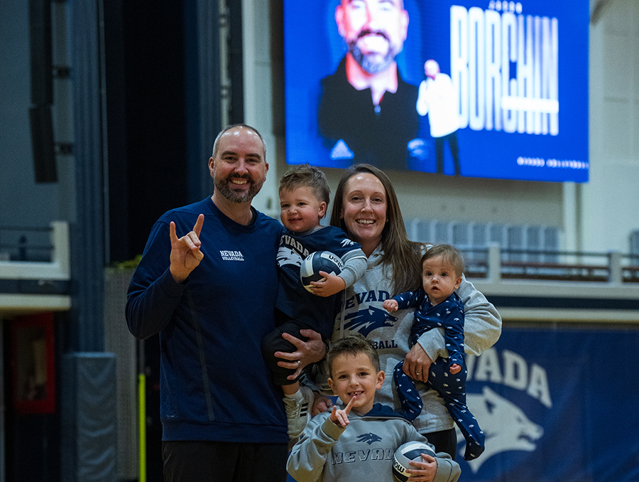 The Borchin Family poses for a photo on the Virginia Street Gym volleyball court