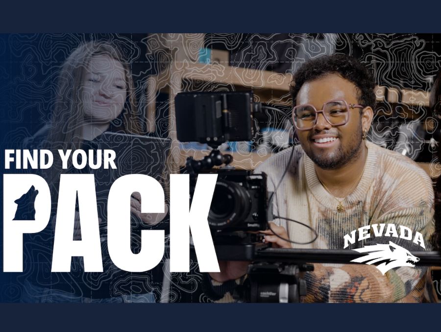 A screengrab of Gabe's video featuring Gabe smiling and holding a video camera and another student looking at him, smiling. "Find Your Pack" is written along with the Nevada Wolf Pack logo.