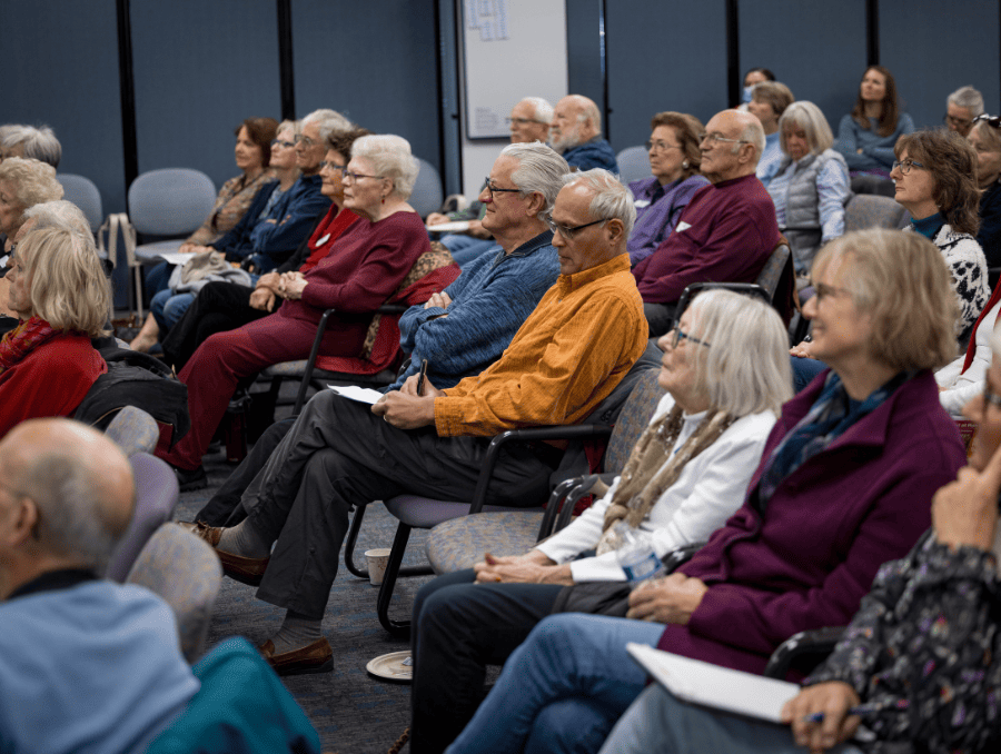 A group of older adults listening to a lecture at OLLI.
