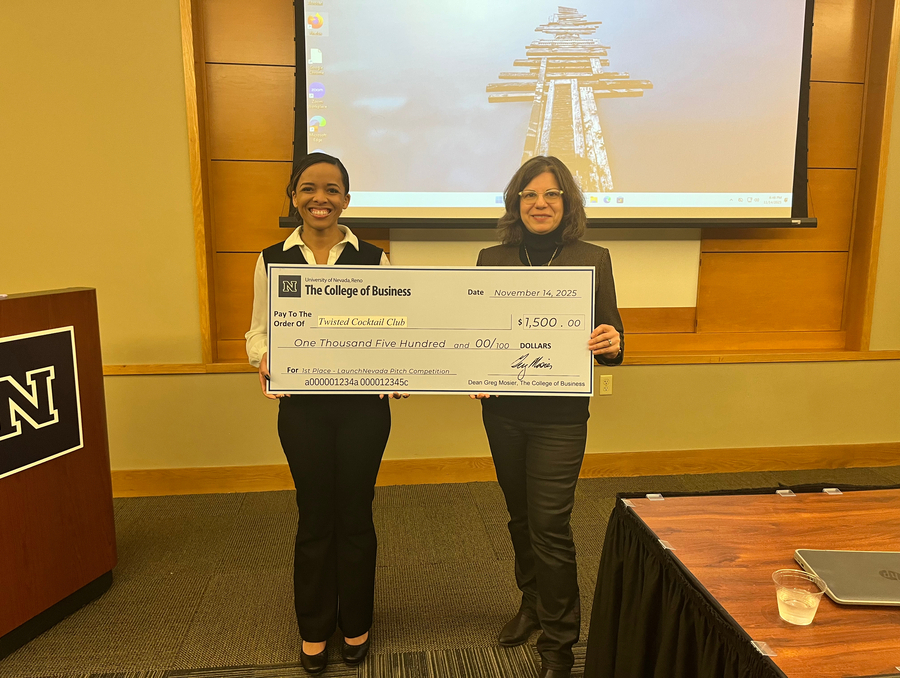 Jordan Raulston, founder of Twisted Cocktail Club, and Armina Karapetian hold the $1,500 prize check for the LaunchNevada Pitch Competition.