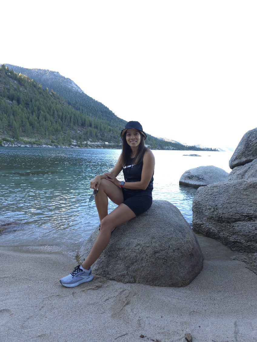Student poses on Lake Tahoe beach.