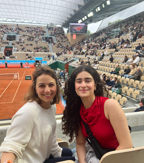 Zeynep Altinay and Duru Dila Canyurt in their seats before a tennis match.