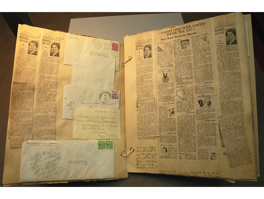 Gladys Belknap Rowley's scrapbook opened to a page showing various news clippings and addressed envelopes.