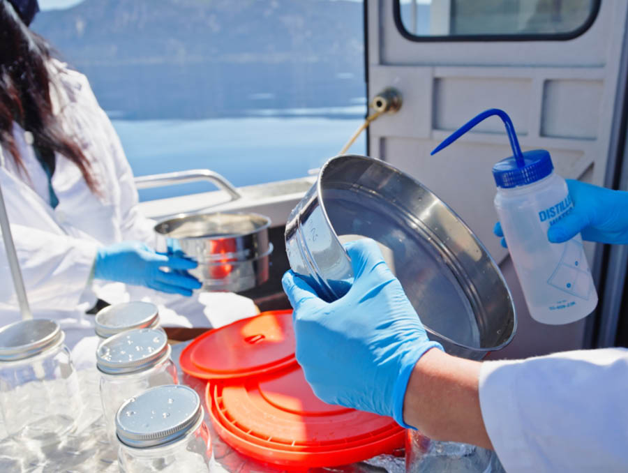 Close-up picture of lab equipment on the boat that someone is handling..