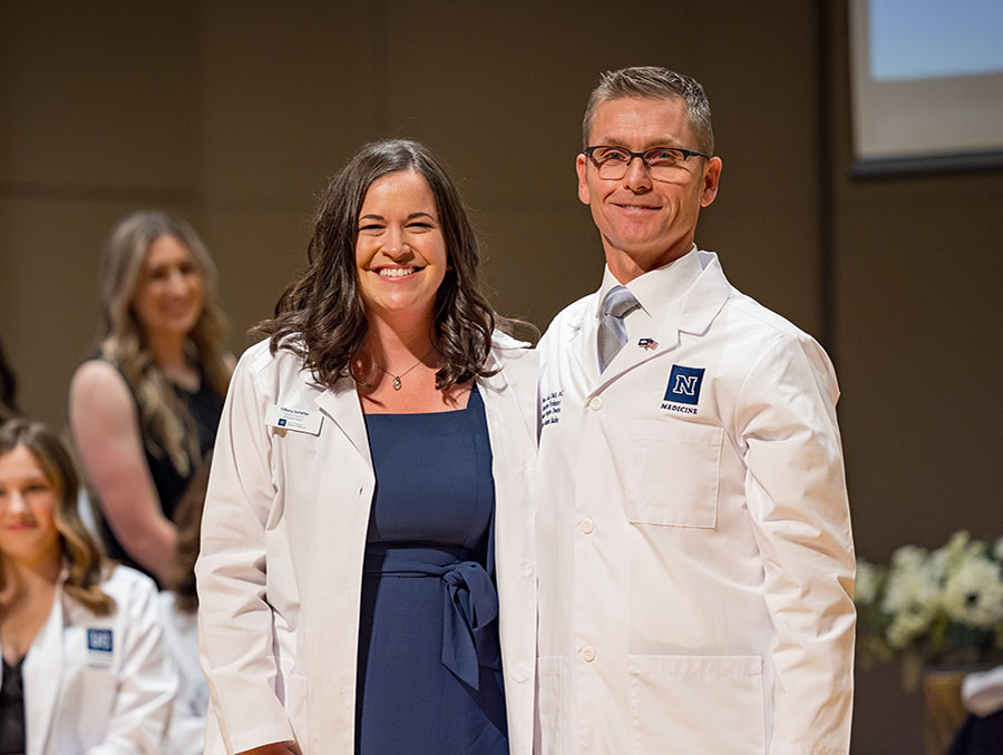 Tiffany Scheller with Brian Lauf, director of the Physician Assistant Studies program, at the Class of 2025 White Coat Ceremony.