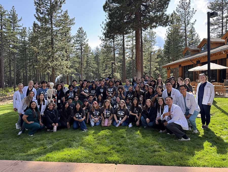 A group of students from the PA program and Upward Bound photographed together at the Lake Tahoe campus.