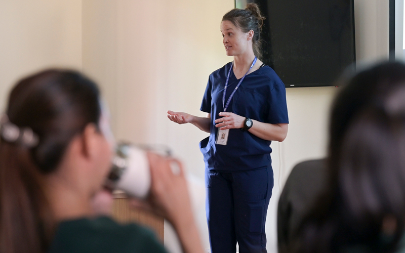A nursing student from the University of Nevada, Reno speaks to a group of nurses.