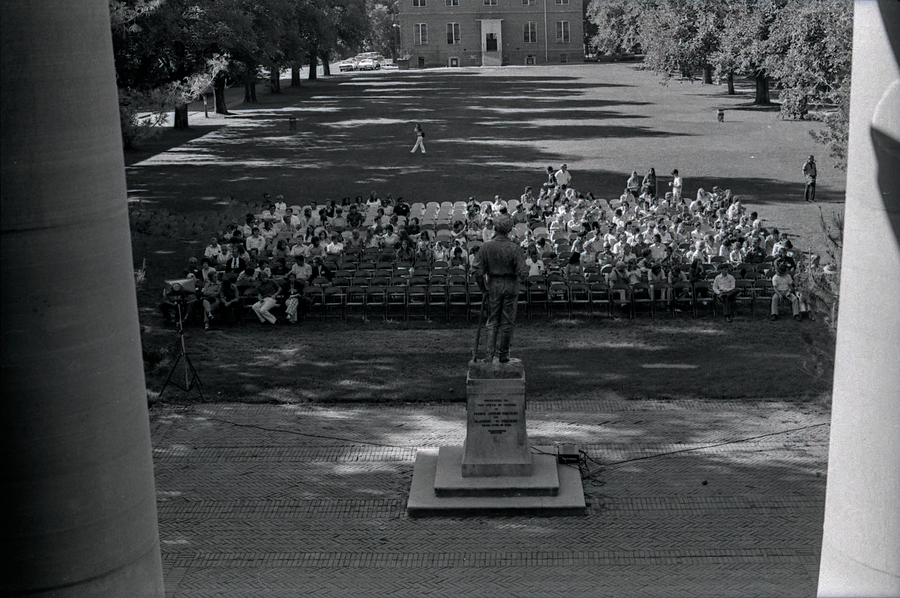 About 100 students in seats on the Quad waiting for orientation to begin.