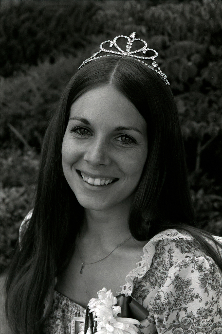 A portrait of a homecoming queen wearing a crown.