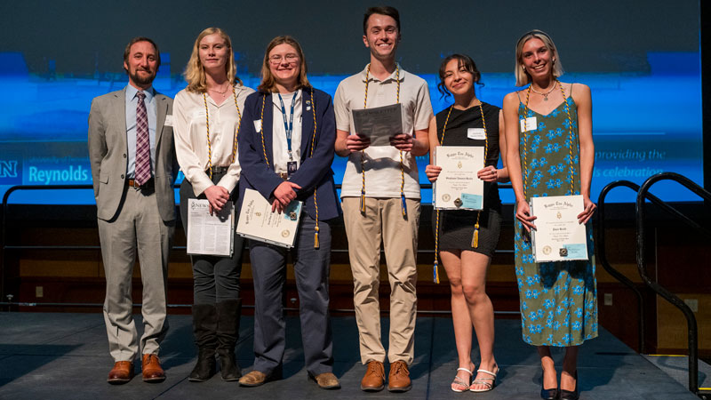 Patrick File and a group of student inductees to Kappa Tau Alpha.