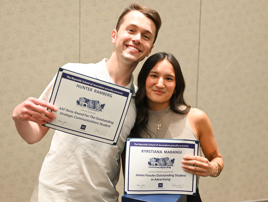 Hunter Ramberg and Kyrstiana Marangi holding up their certificates.