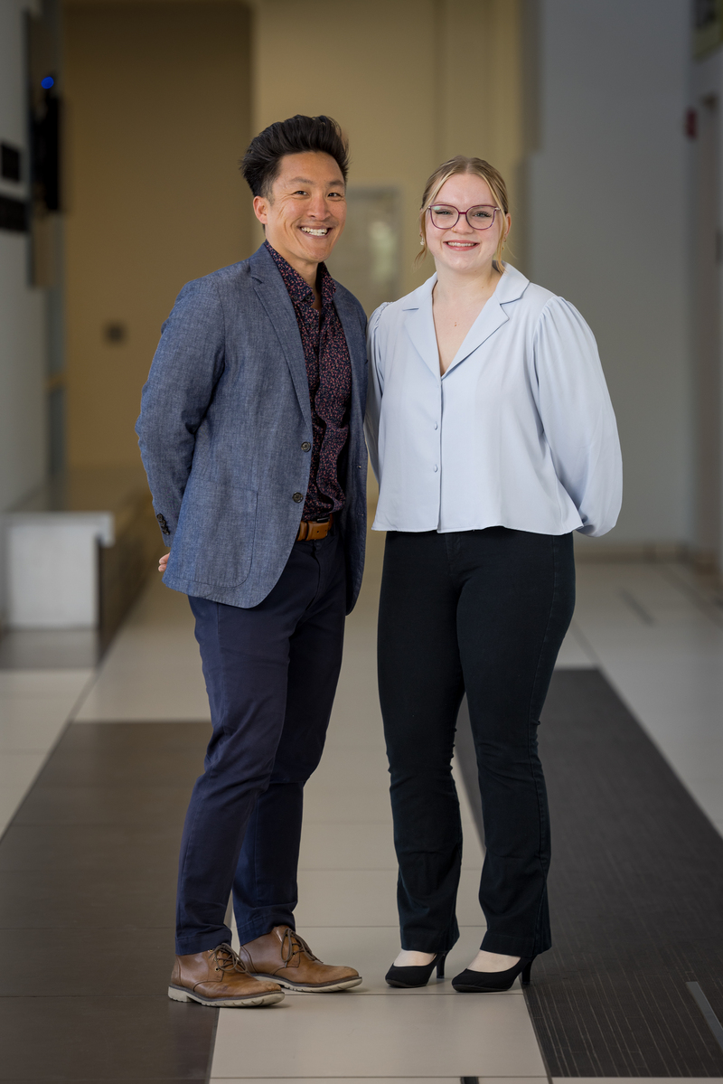 Hannah Marie Taylor with mentor Matthew Hayes posing in a hallway.
