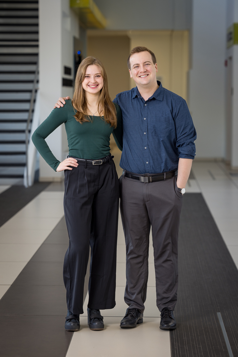 Scholar Kyra Fields with Mentor Joshua Anderson posing in a hallway.