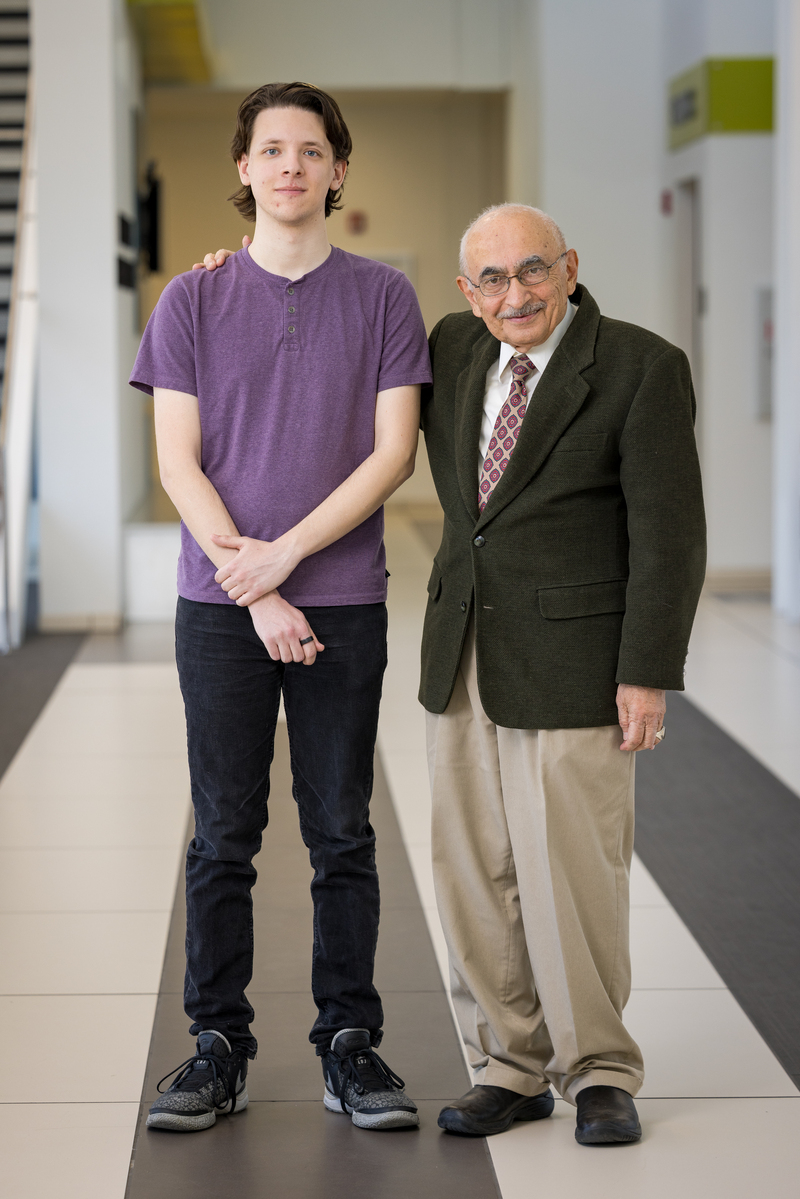 Sean Adams with mentor Mehdi Etezadi-Amoli posing in a hallway.