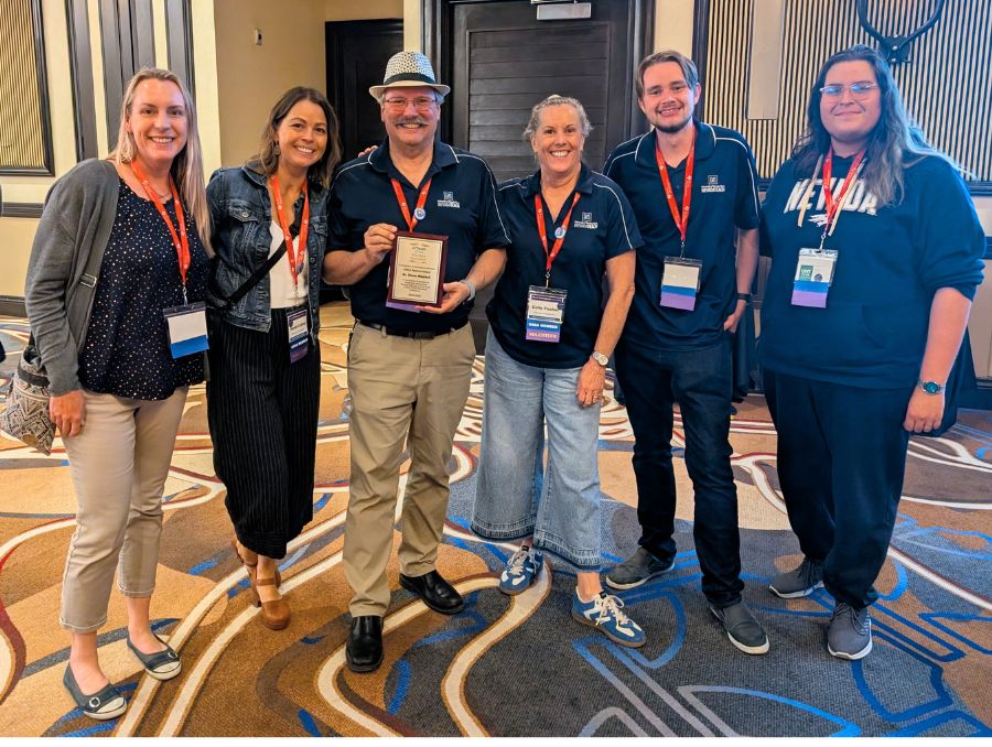 NevadaTeach faculty with Glenn Waddell holding his award.