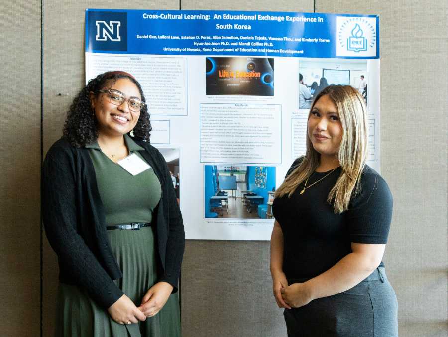 Students presenting their poster at Wolf Pack Discoveries.