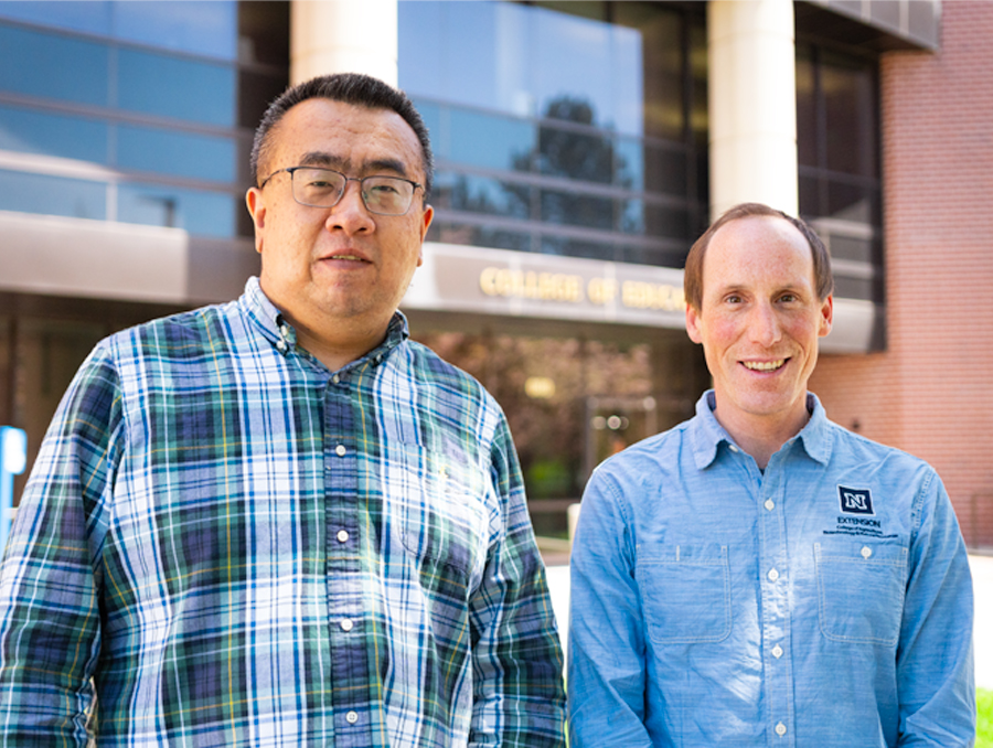 Li Ke and Spencer Eusden in front of the Raggio Building.