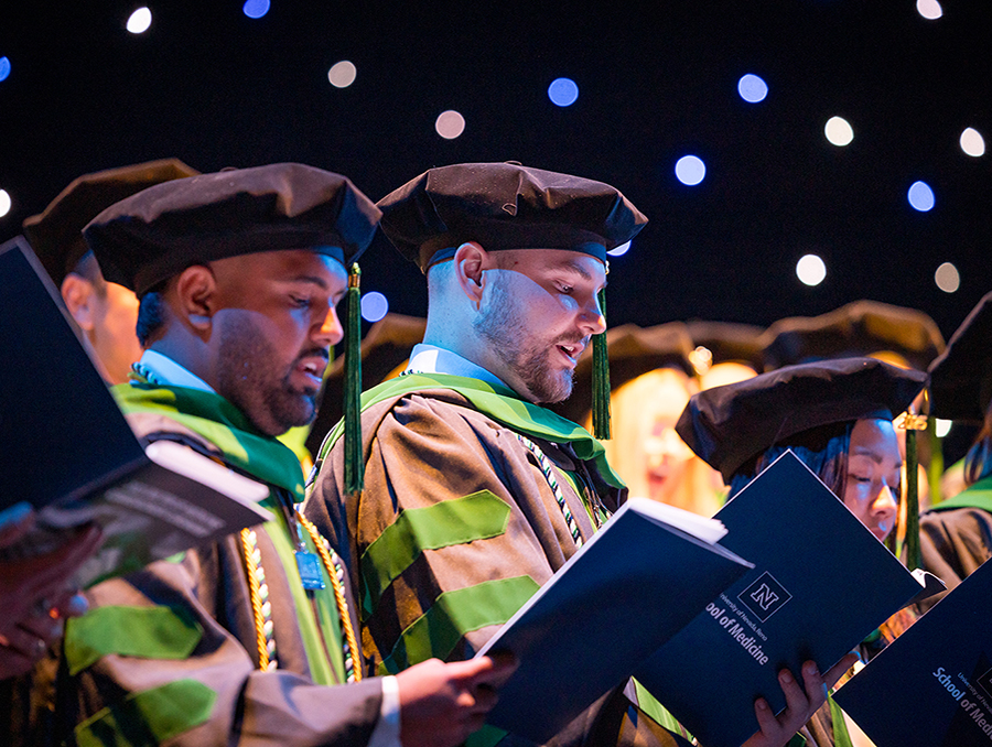 M.D. students reading the Physician's Oath.