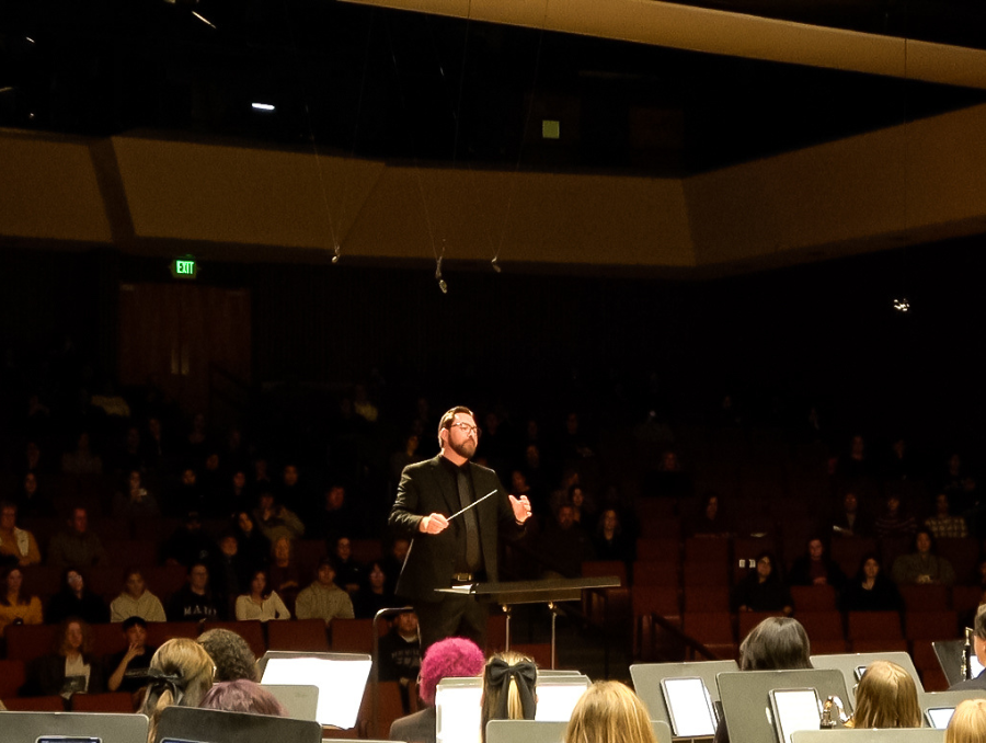 Spencer Hannibal-Smith onstage conducting.