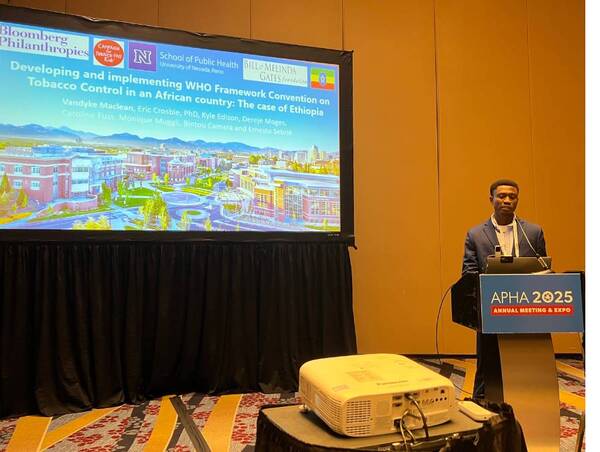 A graduate student presenting at the APHA 2025 conference.