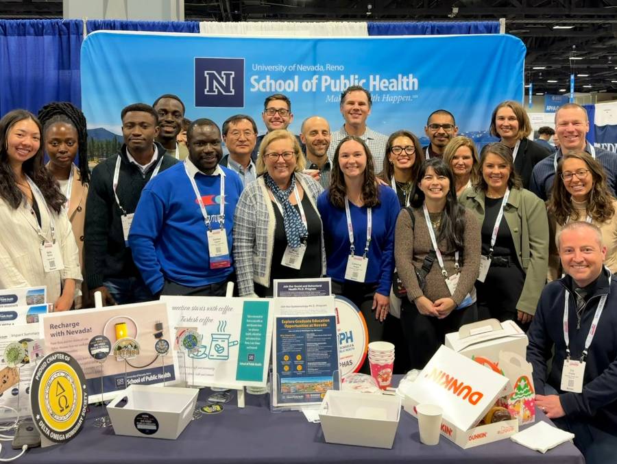 School of Public Health members and guests at APHA 2025 booth.