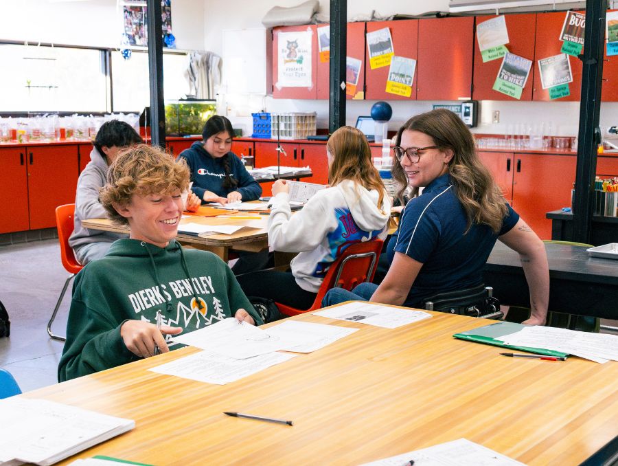 Cassie Eckroth helping students in the classroom.