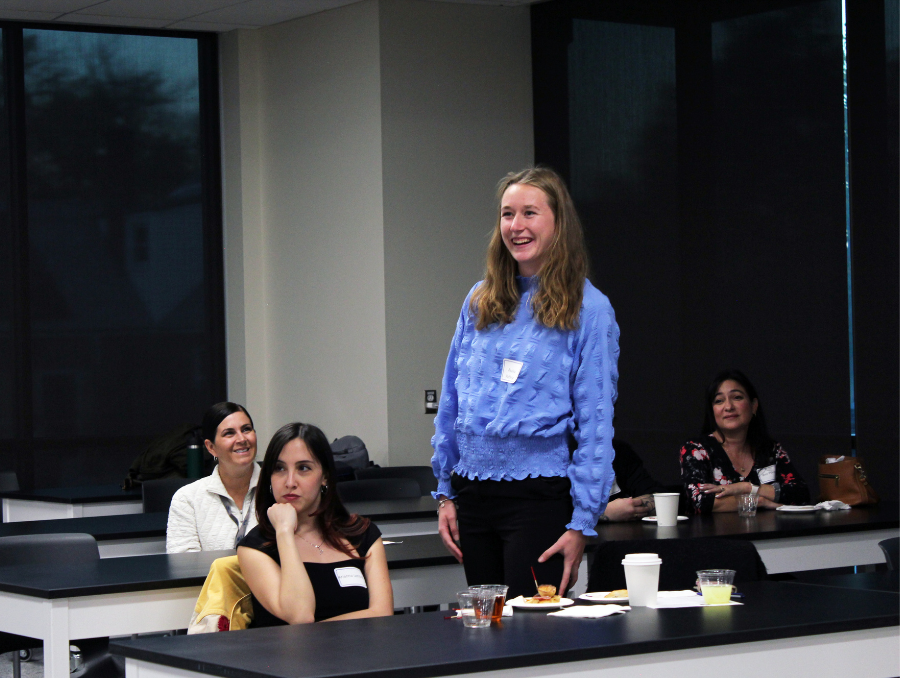 During the Apple Mentorship Program reception, a student introduces herself and shares her excitement about joining the national mentorship initiative.
