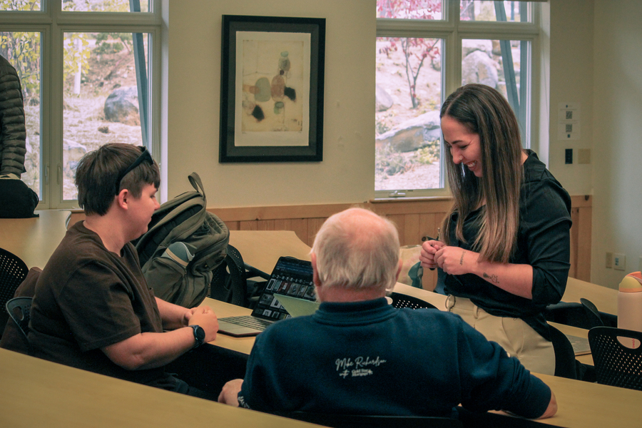 Students collaborating with industry leader Mick Hitchcock.