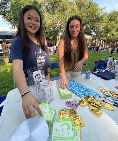 Claire Line of the Condom Collective and the Public Health Coalition hand out contraceptive supplies.