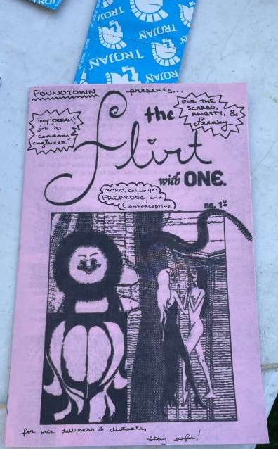 An image of the Poundtown zine and a condom.