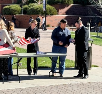 Folding the flag at a flag retirement ceremony at the Joe.