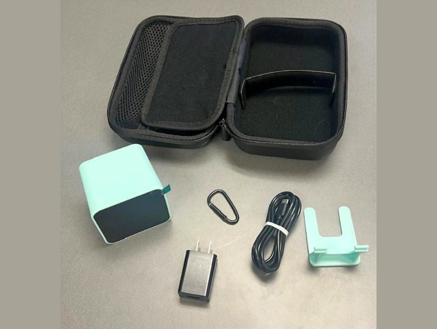 Electronic gadgets arranged next to a small black rectangular zippered bag.